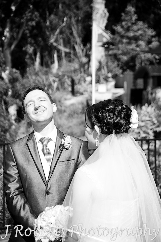 Groom laughing during the wedding ceremony - wedding photography sydney